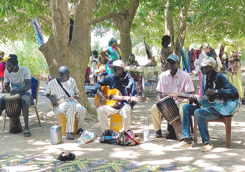 People playing local musical instruments in Senegal